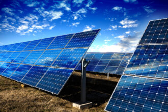 Solar panels and cloudy sky.